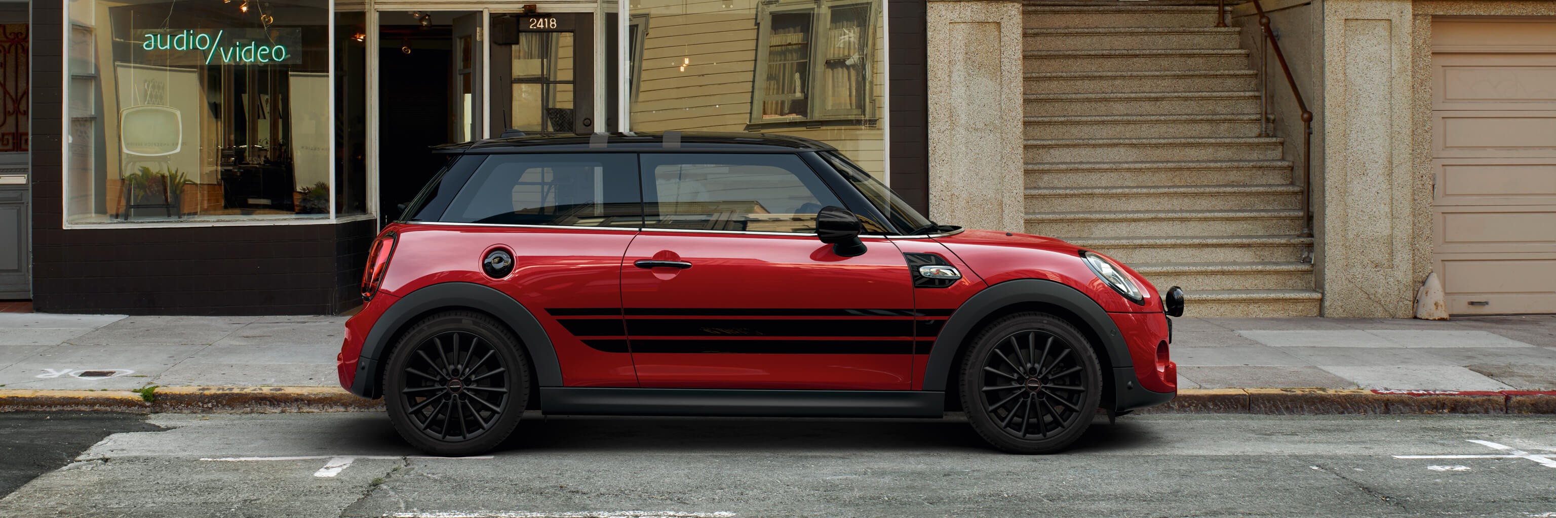 MINi 3-door hatch – red and black – side view MINi 3-door hatch – red and black – side view